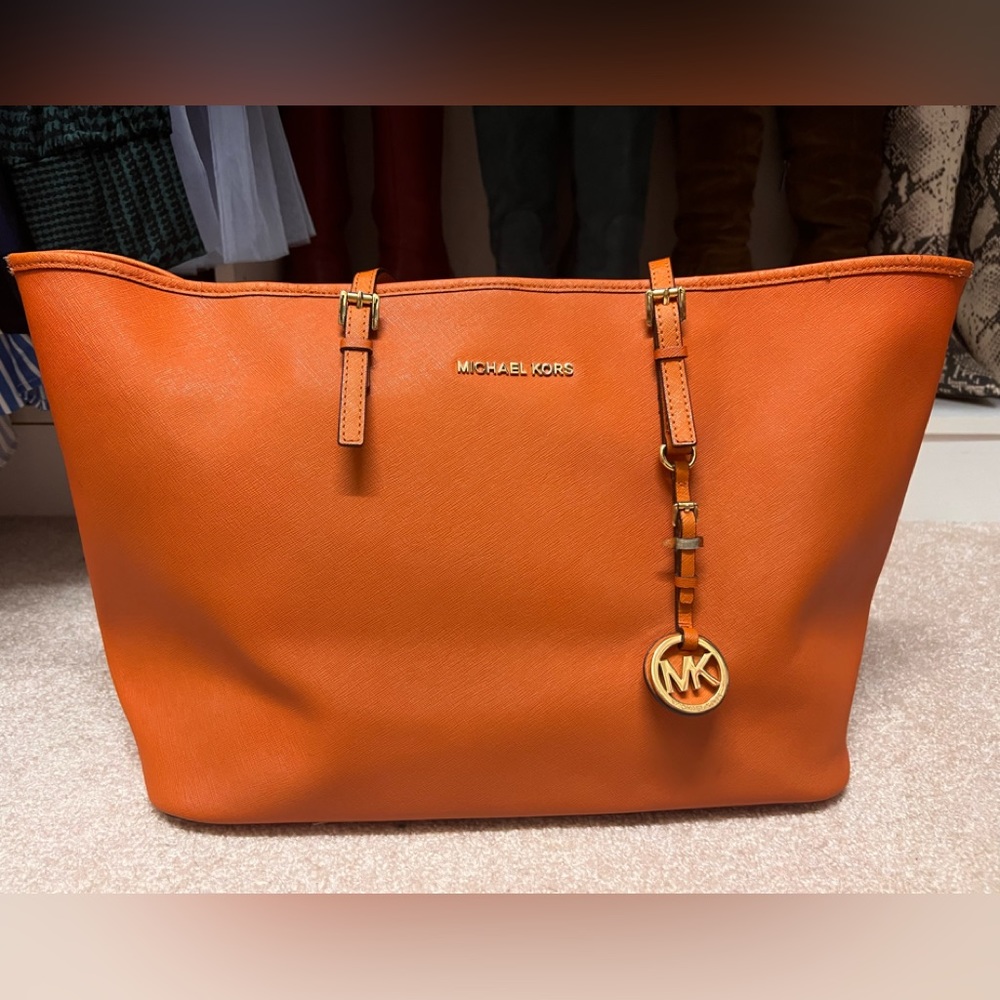 Michael Kors Leather Jet Set Travel Tote
Orange Saffiano